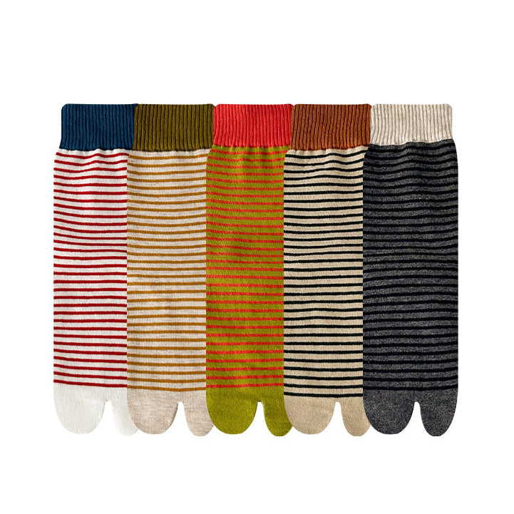 Set of five striped socks in various colors on a white background
