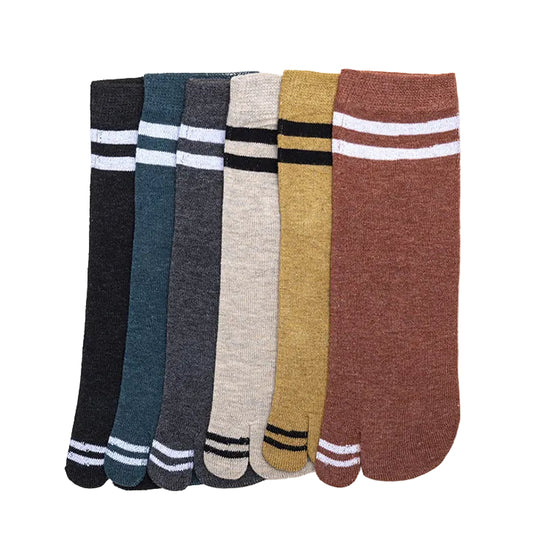 Set of six pairs of socks in various colors on a light gray background