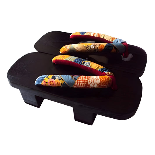 Pair of traditional Japanese sandals with colorful straps on a white background
