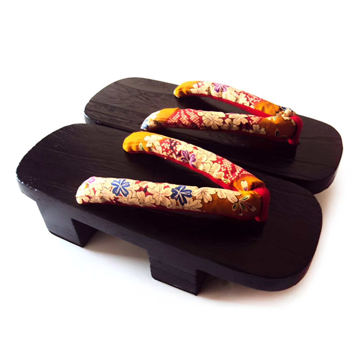 Pair of traditional Japanese wooden sandals with colorful floral straps on a white background