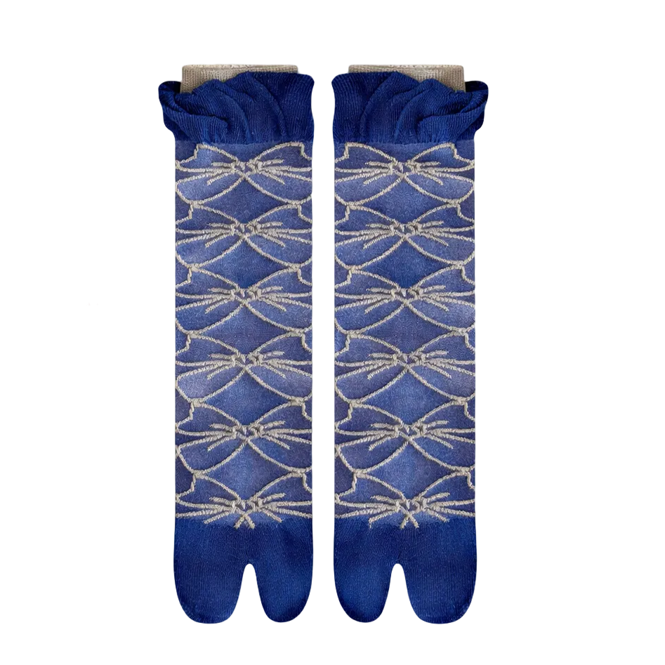 Pair of blue socks with a geometric pattern on a light gray background