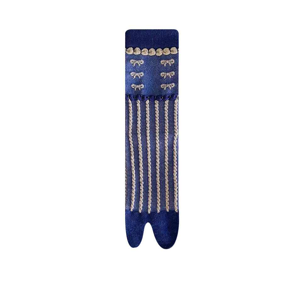 Blue sock with gold fringe and patterns on a white background