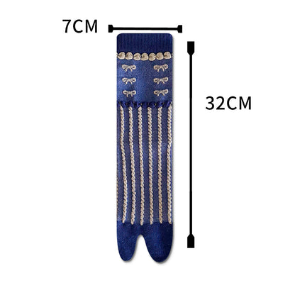 Blue tabi socks with measurements on a white background